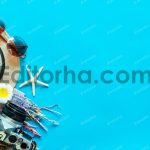 عکس مفهومی سفر؛ دوربین، عینک آفتابی؛ کلاه و ستاره دریایی