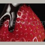 strawberries with green leaves spinning and poured