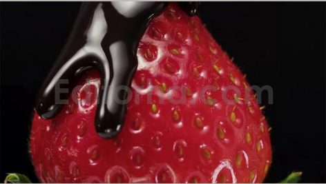 strawberries with green leaves spinning and poured