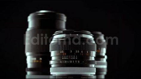 Vintage 50mm Camera Lens Spinning On Black Studio Background