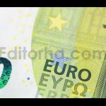 Closeup Examination of Hundred Euro Banknotes Showcasing Its Features