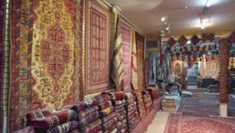 Panning motion inside carpet shop in the Grand Bazaar, Isfahan