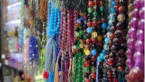 Catholic tradition worship rosary beads local store devotion faith symbols Marian shrine prayer