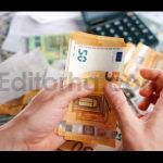 Man Calculating Money Monthly Home Expenses Taxes and Bank Account Balance